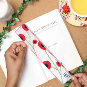 Poppies Cross Stitch bookmark made by Danielle Webb @sprinklesofzeal #freecrossstitchchart #freecrossstitchbookmark #crossstitchbookmark #perforatedcanvasideas #perforatedcanvas #freecrossstitchchart #handmadebookmark #makeitwithzeal #cloverusa #size24tapestryneedle #cloverrotarycutter #backstitching #Howdo youstartathreestrandcrossstitch? #Whatcanyoudo withcrossstitching?